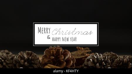Digital composite of merry Christmas and happy new year text on christmas background Stock Photo