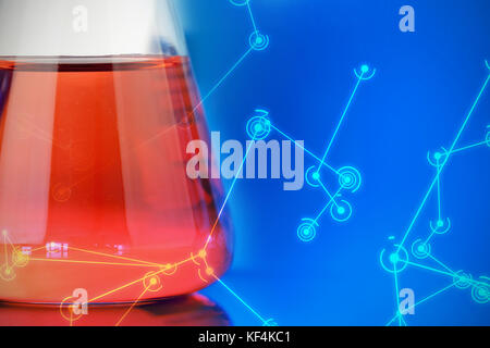 Digitally generated image of molecular structure on screen against blue and red chemical Stock Photo