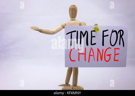 A Conceptual yellow Hand writing caption inscription written sticky note with word Time For Change With black ink on a sticky note pinned to a hand of a sculpture Stock Photo