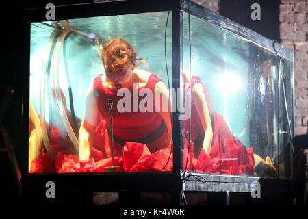 Vocalist Laila Skovmand, a musician with Danish company Between Music, plays underwater in a tank during a rehearsal ahead of their UK premiere concert Aquasonic at the Tramway in Glasgow. Stock Photo