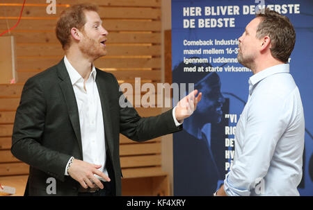 Prince Harry meets Poul Kellberg (right, correct spelling), founder and CEO of Comeback Industries, during a visit to KPH Projects in Copenhagen, Denmark, an organisation which encourages cross-collaboration and support between young people with start-up businesses focused on solving societal issues across the city. Stock Photo