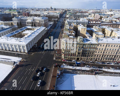 SAINT-PETERSBURG, RUSSIA-CIRCA FEB, 2017: Aerial view at automobile traffic on Nevsky Prospect (avenue) across the frozen Fontanka River along the Ani Stock Photo