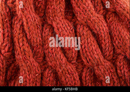Red wool knitted texture background. Top view. Stock Photo