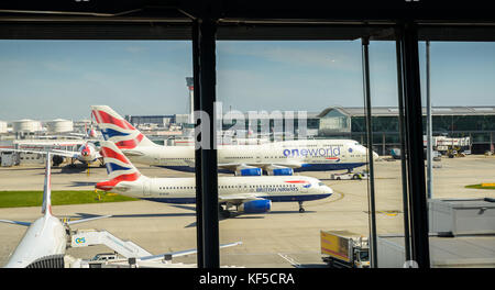 View of British Airways commercial airliners on tarmac at London's Heathrow Terminal 5. Heathrow is the hub of British Airways Stock Photo