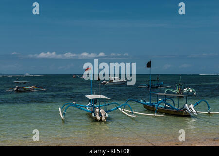 Traditional balinese dragonfly boat on the beach. Jukung fishing boats on Sanur beach, Bali, Indonesia, Asia Stock Photo