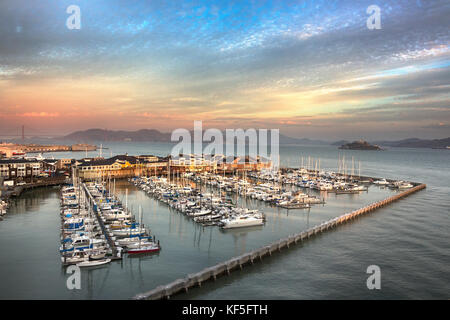 Aerial view of the San Francisco boat harbor with the pier 39 in the background at sunrise, California, USA. Stock Photo