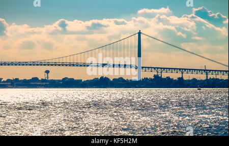 Detroit, MI, USA - 2 October 2016: The Ambassador Bridge spans the Detroit River connecting Detroit with Windsor, Ontario, Canada. Stock Photo
