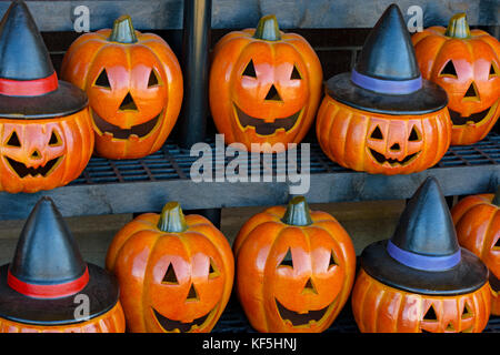 Colorful Halloween ceramic pumpkins are displayed for sale outside of grocery store in Castle Rock Colorado Stock Photo