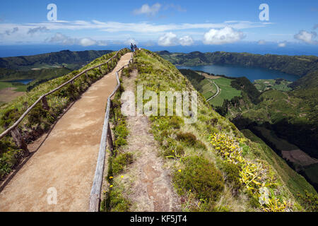 Way to a viewpoint in the volcanic crater Caldera Sete Cidades, at the back on the right crater lakes Lagoa Azul Stock Photo