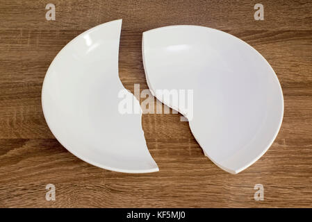 White broken plate on the table Stock Photo