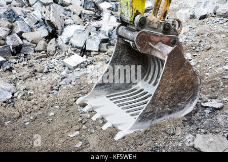 Empty excavator shovel at a construction site Stock Photo