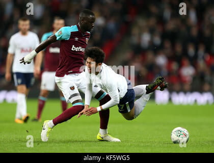 West Ham United's Cheikhou Kouyate (left) and Tottenham Hotspur's Son Heung-Min (right) battle for the ball during the Carabao Cup, Fourth Round match at Wembley, London. Stock Photo