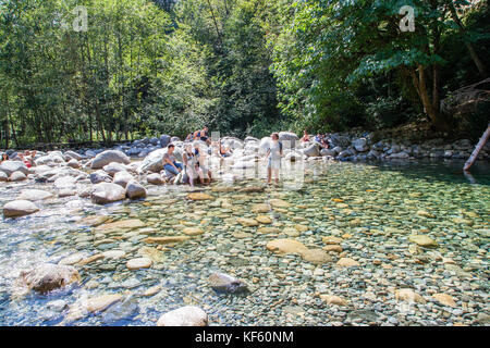 North Vancouver, Canada - Aug. 15, 2017: Visitors cooling off at the 30 Foot Pool in Lynn Canyon Park in North Vancouver. Stock Photo