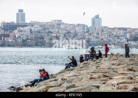 Tourists and local People relaxing near Bosphorus strait Stock Photo