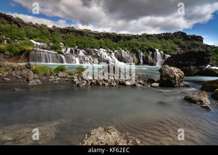 Hraunfossar or Lava Falls, near Husafell Iceland. These beautiful falls come from underneath the nearby lava field near Husafell Stock Photo