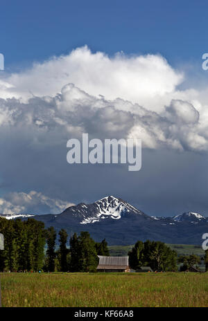 .WYOMING - Afternoon clouds forming over Antelope Flats, viewed from Mormon Row on Grand Teton National Park. Stock Photo