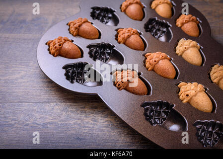 Closeup of Maple Acorn Cakelets acorn shape cookies in a baking pan mold Stock Photo Alamy
