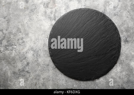 Round grey black slate background Stock Photo