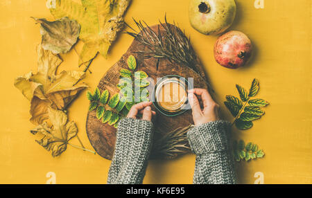 Woman' s hands cup of espresso over yellow background Stock Photo