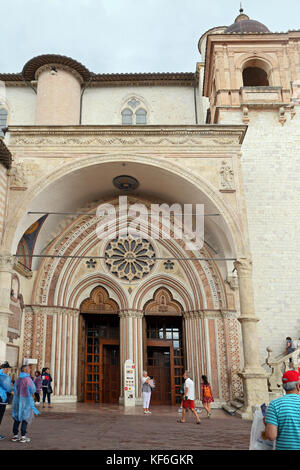 ASSISI, ITALY 30 JUNE, 2017: Famous Basilica of St. Francis of Assisi (Basilica Papale di San Francesco) with Lower Plaza at sunset in Assisi, Umbria, Stock Photo