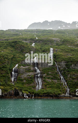 USA, Alaska, Seward, waterfalls spotted near Holgate Glacier seen while exploring Resurrection Bay Stock Photo