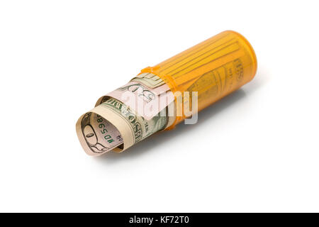 American fifty dollar bills rolled up in a prescription container laying down, on white with a shadow. Stock Photo