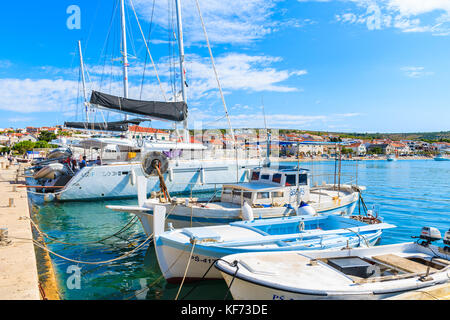 PRIMOSTEN, CROATIA - SEP 5, 2017: sailing and fishing boats anchoring in Primosten port, Dalmatia, Croatia. Stock Photo