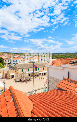 PRIMOSTEN, CROATIA - SEP 3, 2017: View of Primosten old town square from red tile roof top, Dalmatia, Croatia Stock Photo