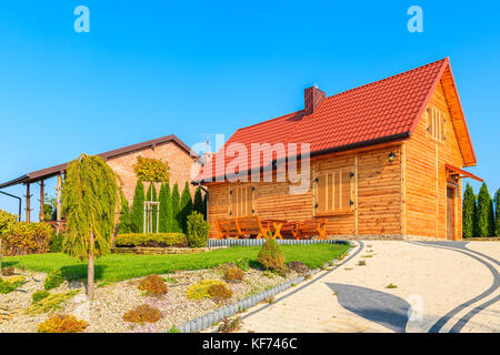 CHANCZA LAKE, POLAND - OCT 17, 2017: wooden house on shore of Chancza lake during autumn season, Poland. Stock Photo