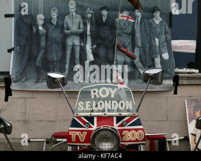 A poster from the film Quadrophenia hangs on a wall above a scooter in Brighton Stock Photo