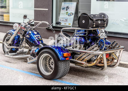 Vintage motorbike three wheeler in the street Stock Photo