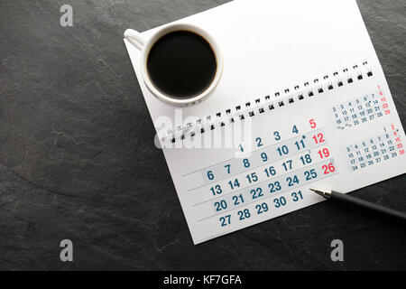 Black Friday, calendar, pen and cup with coffee free space horizontal Stock Photo