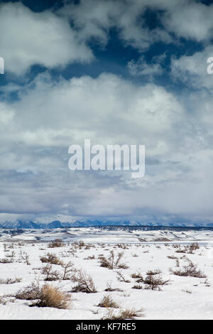 USA, California, Mammoth, cloud covered mountain range surround the road out to the Mammoth Hot Springs Stock Photo