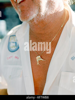 USA, Florida, fishing captain wearing marlin pendant, close-up, Islamorada Stock Photo