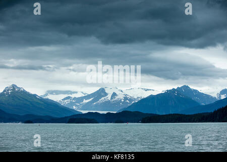 USA, Alaska, Juneau, views of snowcapped mountains while whale watching and exploring in Stephens Passage Stock Photo