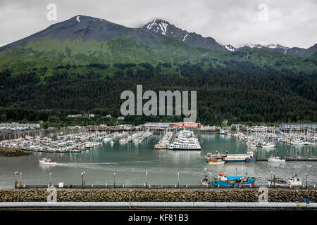 USA, Alaska, Seward, several fishing boats and commercial boats sit moored in the port of Seward Stock Photo