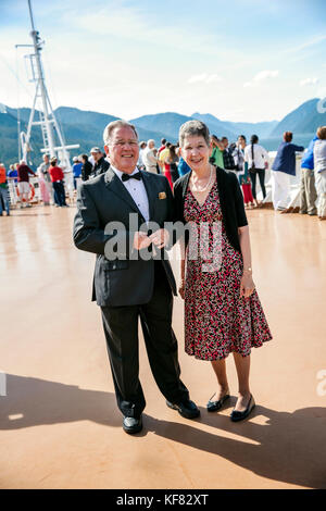 CANADA, Vancouver, British Columbia, one couple enjoys the views off the Holland America Cruise Ship, the Oosterdam, while it navigates the Seymour Na Stock Photo