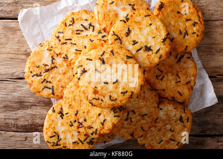 spicy rice cracker with seaweed close-up on the table. horizontal top view from above Stock Photo