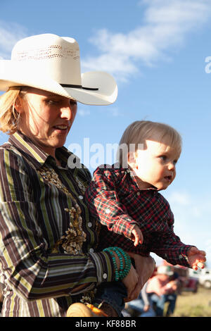 USA, Wyoming, Encampment, a woman and her son are dressed in cowboy attire, Abara Ranch Stock Photo