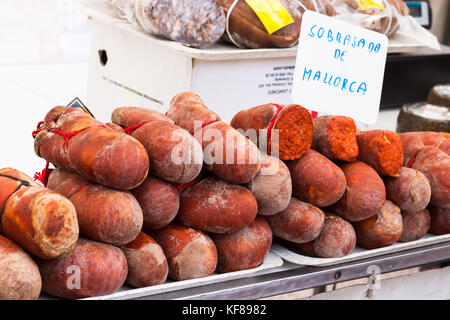 Traditional Majorcan Sobrassada sausage (Sobrasada de Mallorca) for sale in the stall of Sineu market, Mallorca, Spain Stock Photo