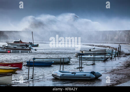 Waves crash over the Cobb at Lyme Regis in Dorset during Storm Brian on Saturday 21st October 2017. Stock Photo