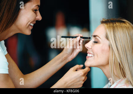 Portrait of beautiful woman getting cosmetic care at beauty salo Stock Photo