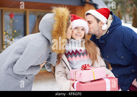Parents taking care about their daughter Stock Photo