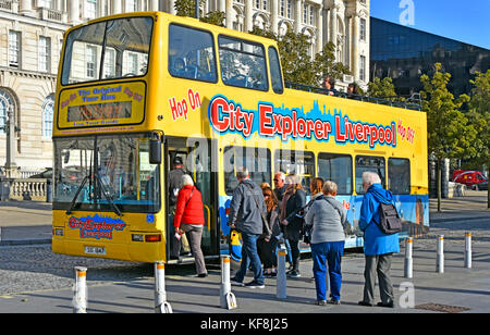 Liverpool open top double decker City Explorer sightseeing tour bus picking up passengers at bus stop on Pier Head Waterfront Merseyside England UK Stock Photo