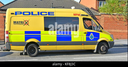 Merseyside police public order Matrix disruption team patrolling in Liverpool in yellow Mercedes Sprinter van fitted with fold down screen protection Stock Photo