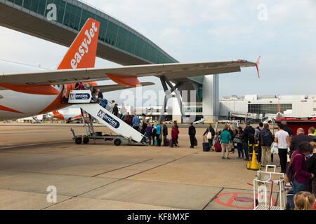 An Easyjet aircraft Airbus A320-214 / flight boarding passengers at London Gatwick Airport, UK. (91) Stock Photo