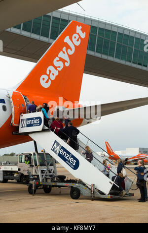 An Easyjet aircraft Airbus A320-214 / flight boarding passengers at London Gatwick Airport, UK. (91) Stock Photo