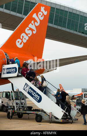 An Easyjet aircraft Airbus A320-214 / flight boarding passengers at London Gatwick Airport, UK. (91) Stock Photo