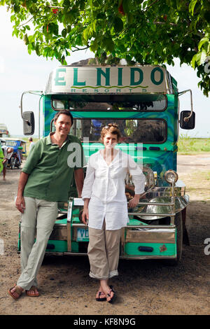 PHILIPPINES, Palawan, El Nido, portrait of photographer Brown W. Cannon III and journalist Katja Klinger in the town of El Nido, on assignment for GEO Stock Photo