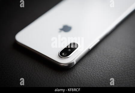 New Iphone X model close up.Modern Iphone 10 smart phone model.Trendy mobile device.White Apple Iphone mobile phone with big screen and dual camera Stock Photo